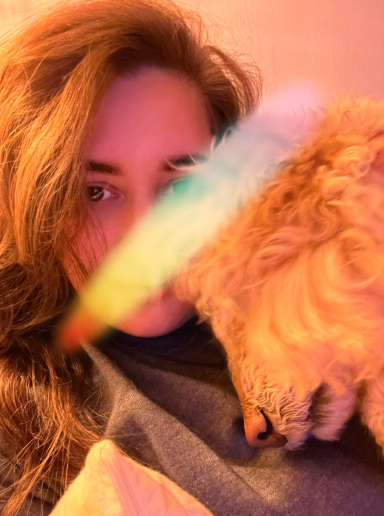 Rachel Fox London escort in a cosy sleepy selfie with her puppy.